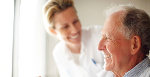 Nurse smiling at an elderly patient